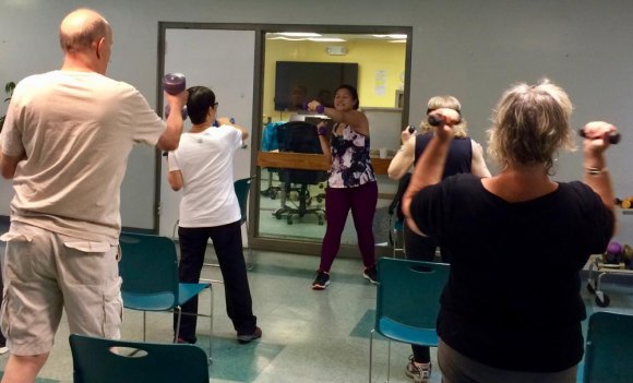 Lisa Fernandez Wins the Total Fitness Challenge, Under Protest Who's doing the exercise correctly here? You decide.